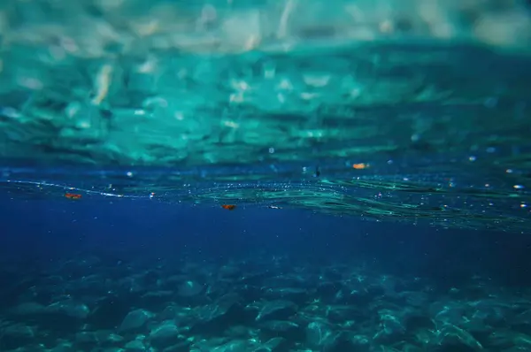 Underwater surface blue sea background