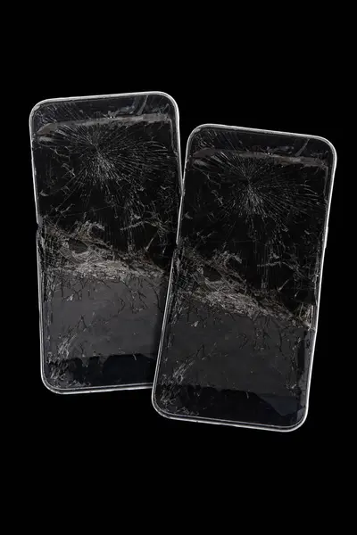Mobile smartphone with broken screen on black background.