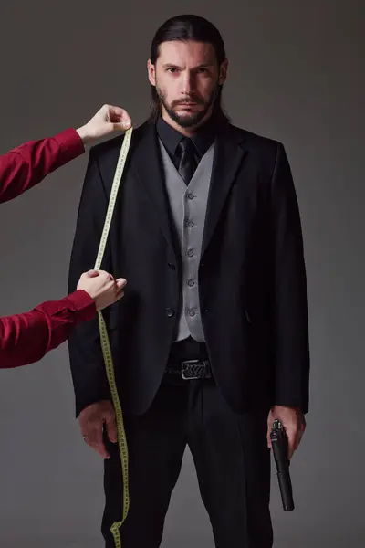 Tailor Measuring Arm Length Bespoke Suit Studio Portrait Bearded Young Royalty Free Stock Images