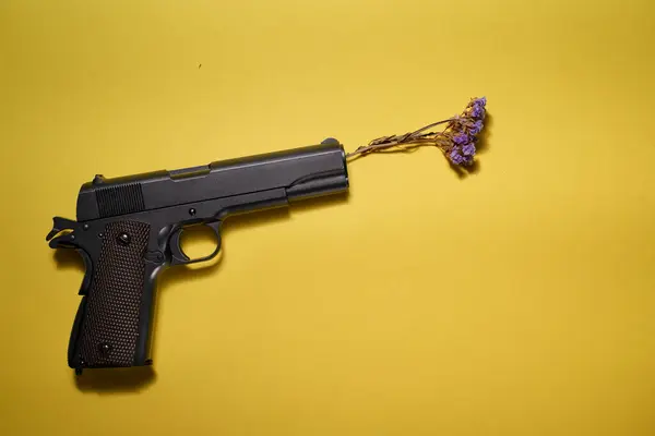 Pacifist Concept Big Black Gun Pisto Flower Its Barrell Yellow — Stock Photo, Image
