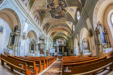 ODORHEIU SECUIESC, ROMANIA - MAY 27, 2022: The interior of the Franciscan church, built by Franciscan monks between 1713-1779.It has 7 altars and an organ.Interior walls were painted between 1780-1781