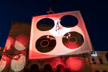 TIMISOARA, ROMANIA - JUNE 15, 2019: Italian actors in night show air theater on the street, European Festival of Performing-Romanian Drama Festival, organizing by City Hall in Victory Square.