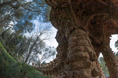 Barcelona, Catalonia, Spain - Feb. 28,2022: Colonnaded in Vaulted Passage in Park Guell on Carmel Hill, architect Antoni Gaudi. Built 1900-1914, officially opened in 1926. UNESCO World Heritage Site.