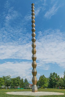 TARGU JIU,ROMANIA-JULY 23,2020:The Endless Column (Column of Infinite) made by Constantin Brancusi in Targu Jiu, Romania. Symbolizes the infinite sacrifice of Romanian soldiers of the First World War. clipart