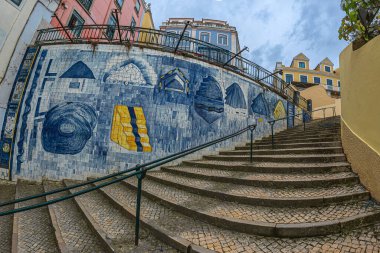 LISBON, PORTUGAL - 6 APRIL 2024: Beautiful wall on R. da Mae de Agua street, decorated with a modern artwork in the local technique of decorated ceramics called Azulejos, by artist Luis Camacho. clipart