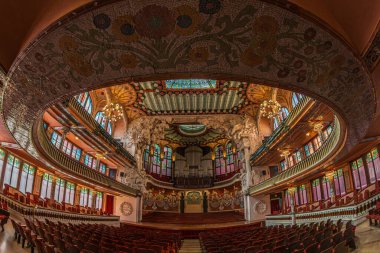BARCELONA, CATALONIA, SPAIN - APRIL 14, 2024: Interior of Palace of Catalan Music, a concert hall designed in the Catalan modernista style by the architect Lluis Domenech i Montaner. Built 1905-1908. clipart