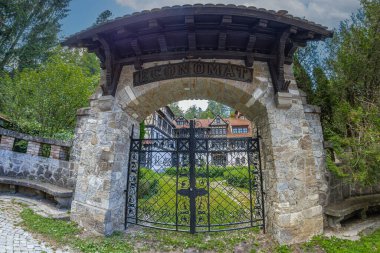 The entrance of the Economat Hotel, a building with 60 rooms built in 1900 in the German Renaissance style and extended in 1908-1909. Part of the Peles castle complex buildings, Sinaia, Romania. clipart