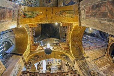 VENICE, ITALY - MARCH 17, 2023: Interior of the medieval Patriarchal Cathedral Basilica of Saint Mark (Basilica Cattedrale Patriarcale di San Marco), known as St Mark's Basilica. Golden mosaics. clipart