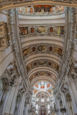 SALZBURG, AUSTRIA - APRIL 27, 2023: Interior of the medieval Salzburg Cathedral, the XVII th-century Baroque cathedral dedicated to Saint Rupert and Saint Vergilius. Founded in 774, rebuilt in 1181. clipart