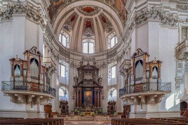 SALZBURG, AUSTRIA - APRIL 27, 2023: Interior of the medieval Salzburg Cathedral, the XVII th-century Baroque cathedral dedicated to Saint Rupert and Saint Vergilius. Founded in 774, rebuilt in 1181. clipart