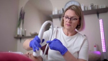 Hardware cosmetology. Hardware cleaning of the face of an Asian woman. High quality 4k footage