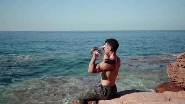 Athlete Beautiful Body Large Muscles Raises His Hands Dumbbells Nature — Stok video