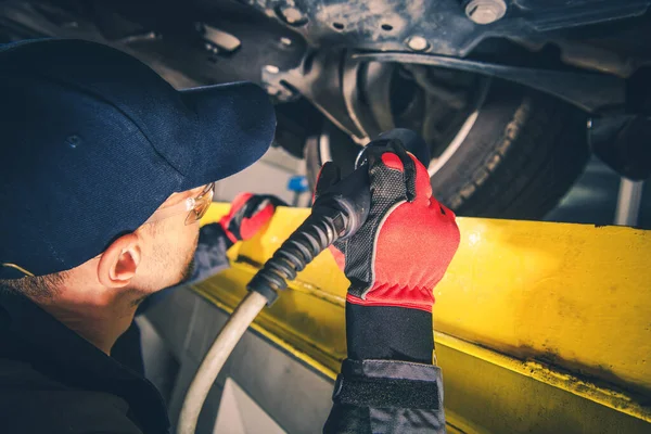 Professional Mechanic Checking Vehicle Undercarriage Using Flashlight Scheduled Car Inspection — Stock Photo, Image