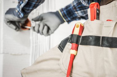 Construction Industry Theme. Working Electrician Contractor Skrew Drivers Close Up. 