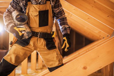 Closeup of Professional Construction Worker with Ventilation Duct in His Hand Working on Residential Air Supply System Installation.