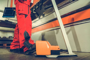 Heavy Duty Metal Folding Machine Operator Starting Process by Pressing Foot on Machine Safety Pedal