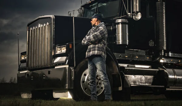 Trucker in His 40s and His Semi Truck. American Ground Transportation Industry Theme. Lorry Driver.