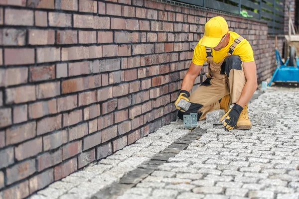 Professional Caucasian Contractor Finishing Laying Pavers Driveway Fence Yard Residential — Stock Photo, Image