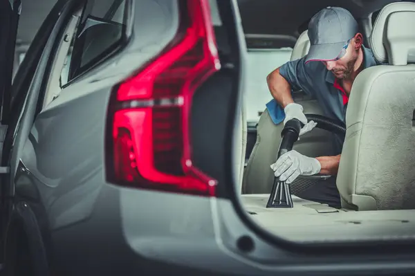 Caucasian Car Dealership Worker His 40S Vacuuming Cleaning Vehicle Preparing — Stock Photo, Image