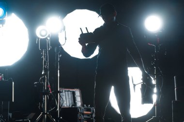 Caucasian Video Production Studio Operator Preparing His Drone For a Flight clipart