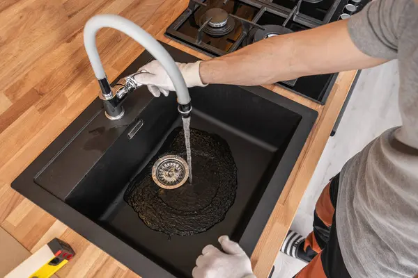 Caucasian Plumber Checking Kitchen Water Supply Testing Sink Faucet — Stock Photo, Image