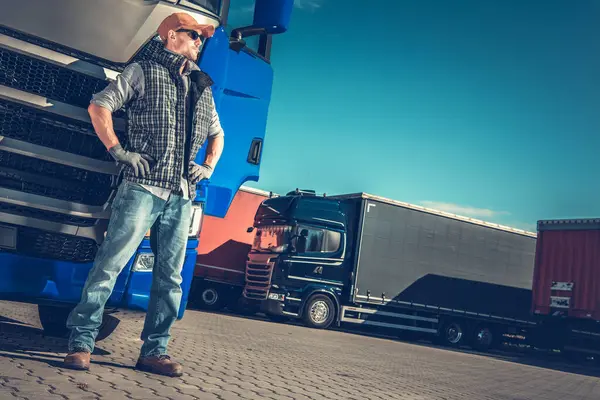 Caucasian European Semi Truck Driver Staying Next His Blue Semi Stock Image