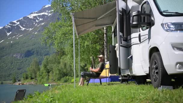Caucasian Traveller Relaxing Front His Campervan Watching Surrounding Views Binoculars — Stockvideo