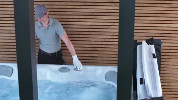 Man Seen Thoroughly Cleaning Hot Tub Empties Water Scrubs Interior — Stockvideo