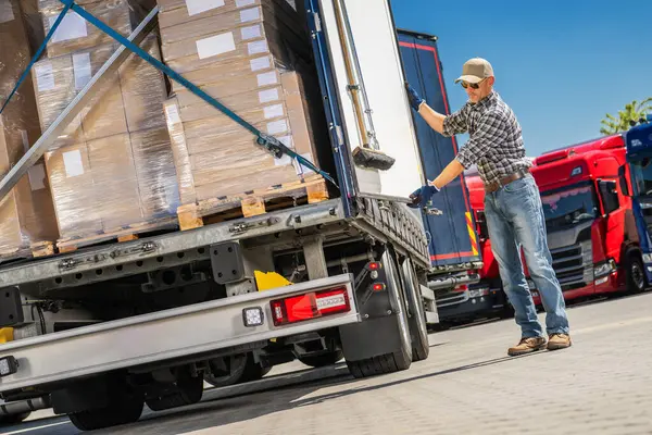Truck Driver Loading Cargo Boxes Commercial Truck Leaving Lot Delivery Лицензионные Стоковые Фото