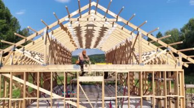 İnşaatçılar üzerinde açık bir gökyüzü ve arka planda güzel bir manzara olan büyük ahşap bir yapı çerçeveliyorlar. Sanatçılık, sıkı çalışma ve kendini adamışlık sergiliyor..