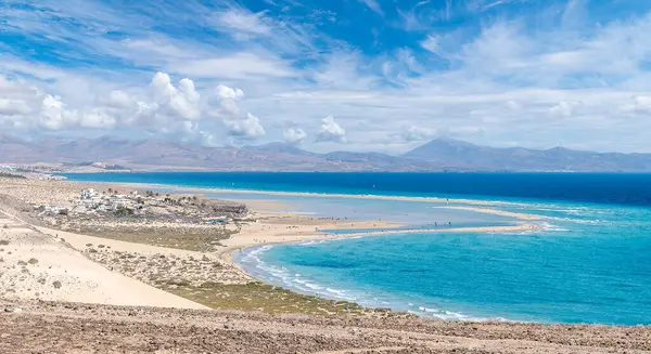 Playa de Sotavento, Fuerteventura: a breathtaking aerial view of crystal-clear lagoons and sweeping sand dunes on this iconic Canary beach.