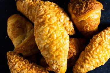 Fresh white bread and milk in white glass on black stone table background. Top view Studio shot
