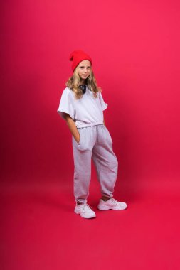 Child music concept. Teenager girl dance in rhythm of melody, listens song in headphones