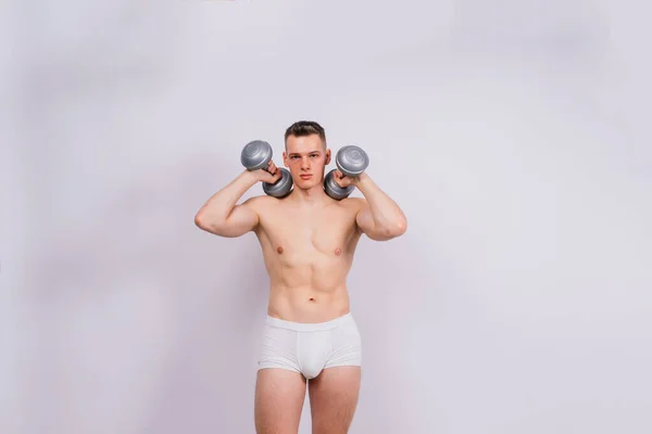 Shirtless Bodybuilder Holding Dumbell Showing His Muscular Arms — Stockfoto