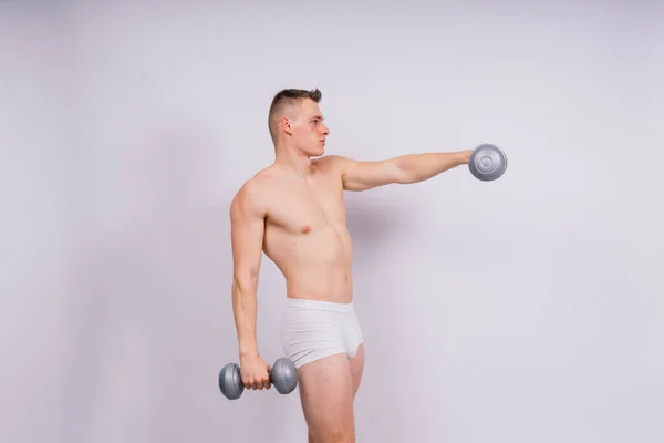 Shirtless Bodybuilder Holding Dumbell Showing His Muscular Arms — 图库照片