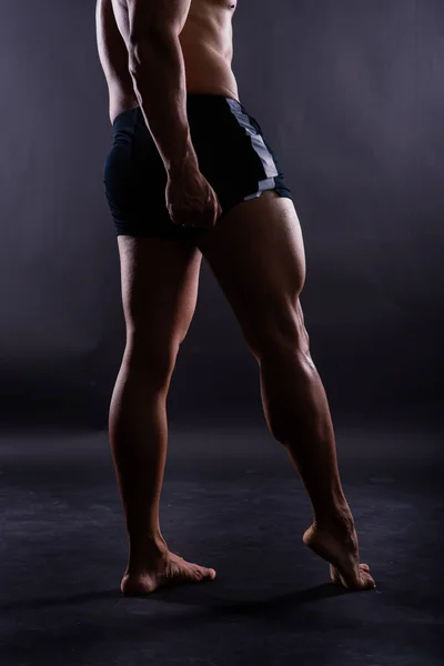 Muscular Male Legs Close Studio Shot Dark Background — Stock fotografie