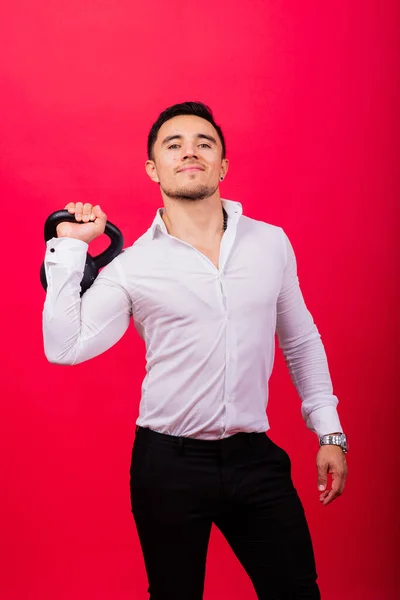 Attractive Businessman Exercising Kettlebell Studio Red Background — Stock Photo, Image