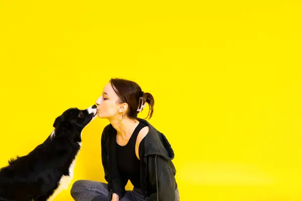 Friendship between people and animals, a studio shot, love, tender, warm feeling and emotion
