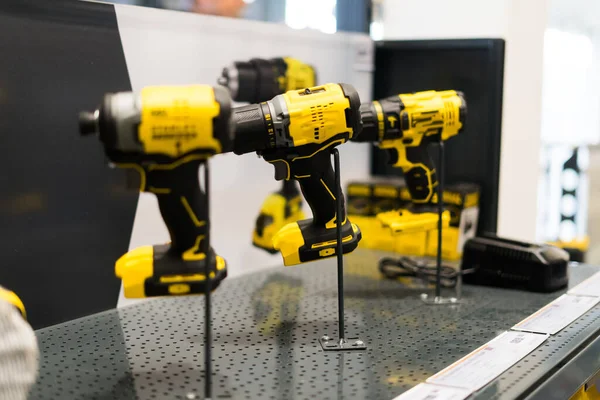Power tools, drills and hammers of various manufacturers are sold in hardware store.