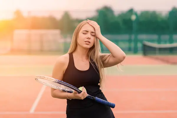 Tennis tournament. Female player at clay tennis court