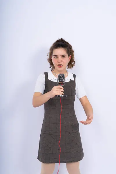 stock image Young girl singer perform karaoke isolated on a white background