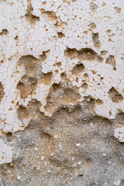 Full frame frontal detail shot showing a flaking of plastering surface