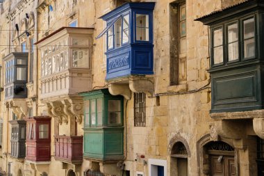 Traditional colourful enclosed wooden balconies, called gallariji, on St. Paul Street - Valletta, Malta