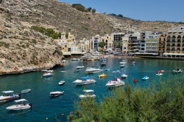 Xlendi (or ix-Xlendi, as the locals refer to it) was once a tiny fishing village, but today it is a bustling small town and seaside resort located on the Southwest coast of Gozo Island - Xlendi, Malta clipart