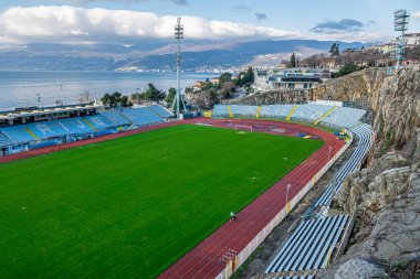 City of Rijeka, Croatia, Jan 25 2023, View of the unique stadium of football club Rijeka, near the Adriatic sea in the morning sky. The Kantrida stadium is located between a large rock and the sea.                            
