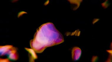 Siyah arkaplanda soyut bulanık ışıklar.