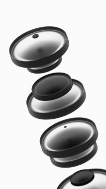 Yüzen bir düzende siyah dairesel nesnelerin soyut bileşimi.