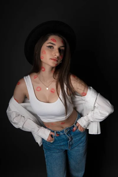 young beautiful girl with red kiss prints on skin