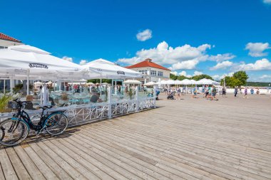Sopot, Poland - April 20, 2020: Crowds of tourists near the Pier in Sopot and Grand hotel