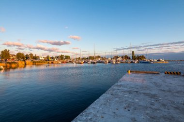 Harbor of the tiny holiday resort town Jastarnia in the North Coast of Poland, Baltic Sea. Sunset time